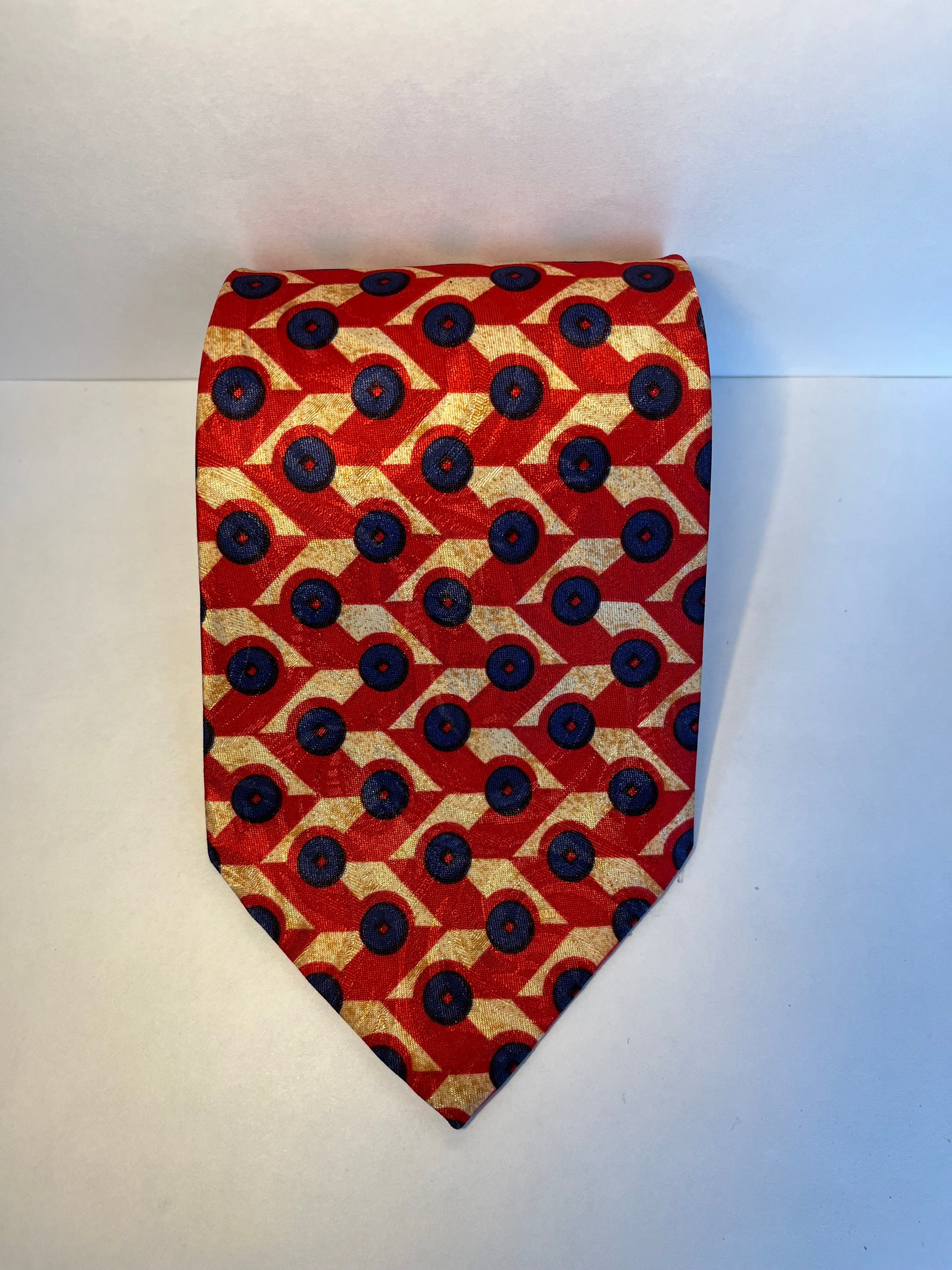 Red blue and tan patterned tie