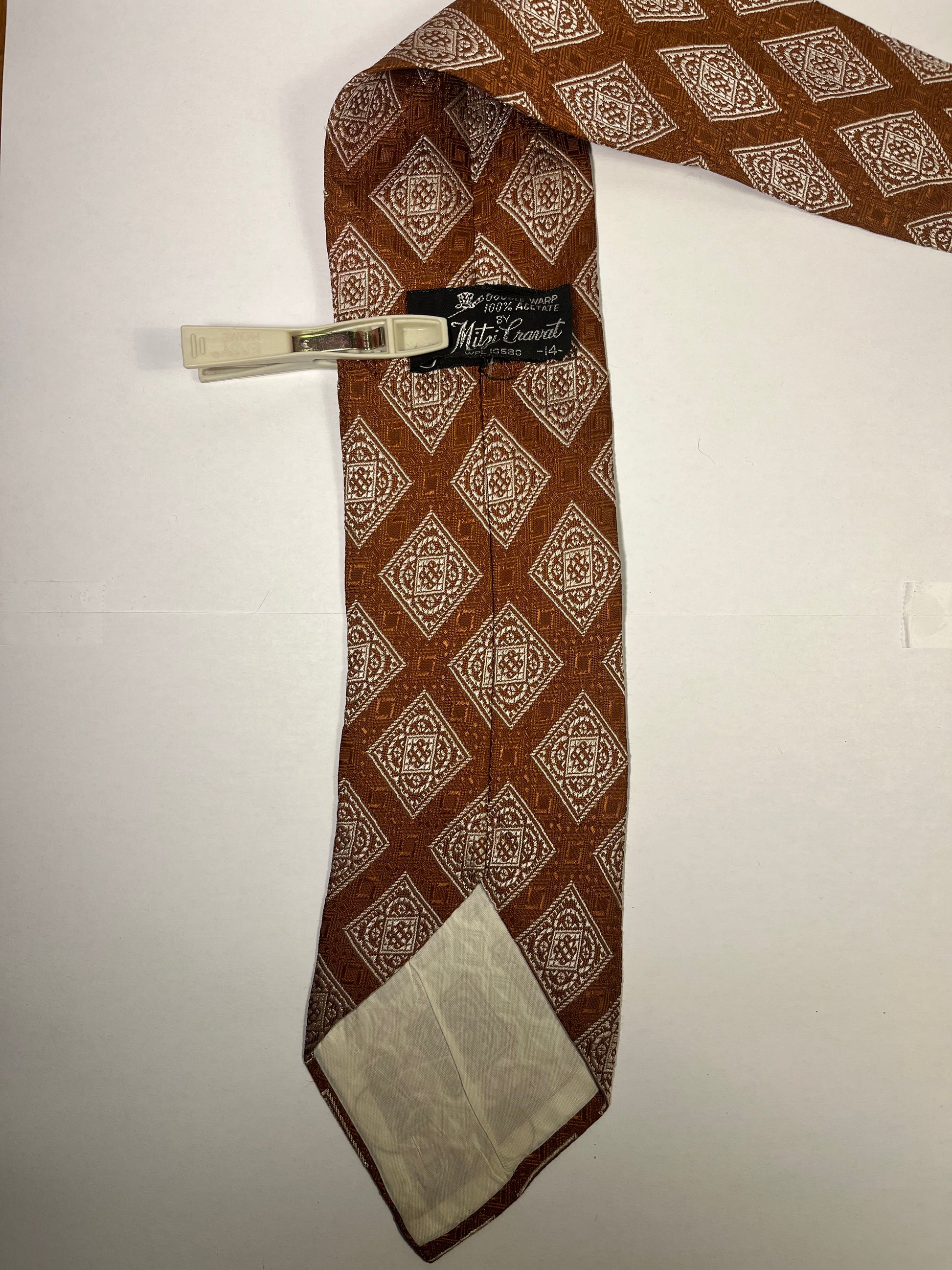 Brown triangular patterned tie